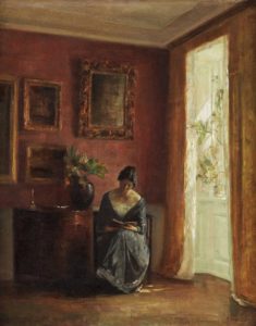 Interior with woman reading by the window